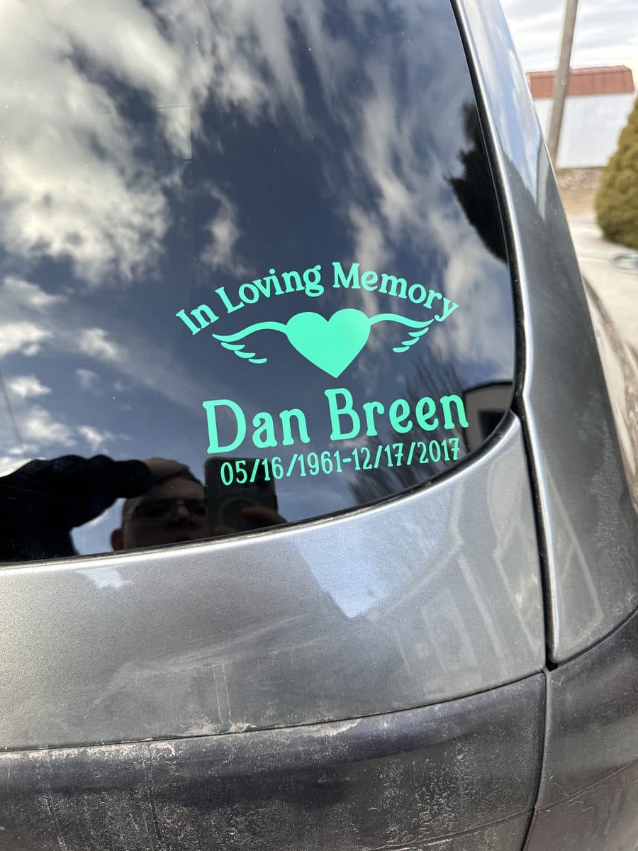 Customer's installed memorial decal in teal — In Loving Memory · Dan